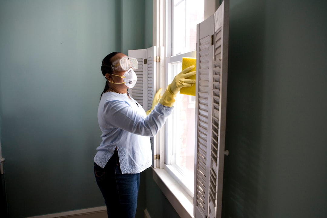 about-img-01 When renovating a home, you should use a damp sponge or cloth to clean dust collected on a window sill, as the dust may contain asbestos or lead-based paint. Home maintenance is an ongoing process for any homeowner, and here we see an African- American woman who’d taken a damp sponge to her window’s frame, in order to remove accumulated dust particulates. Note how the homeowner had donned a pair of waterproof gloves, a facemask, and a pair of goggles, prior to beginning this task.